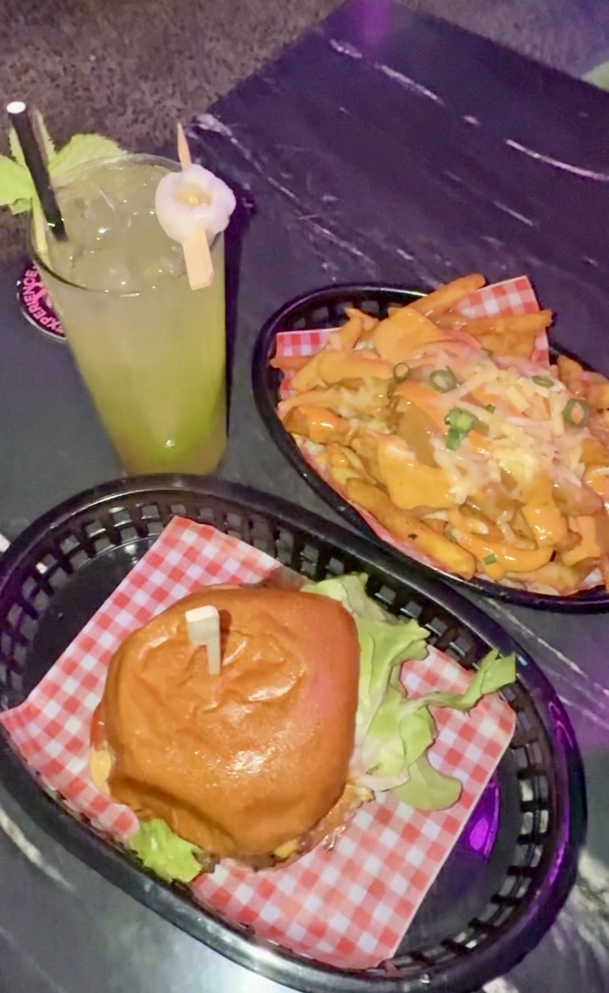 Veggie burger, loaded fries and a green cocktail at Milky Lane in Cairns