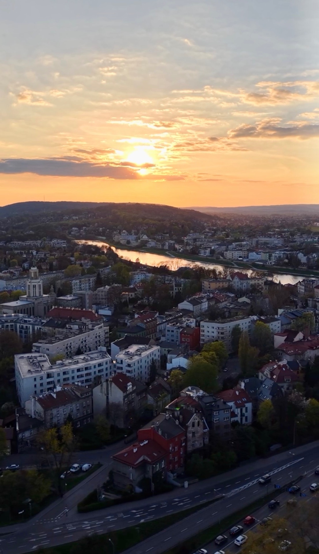 Aerial sunset over Kraków rooftops and the Vistula River